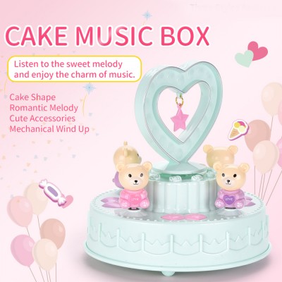 The best selling cake music box is suitable girls' romantic chain-winding toys